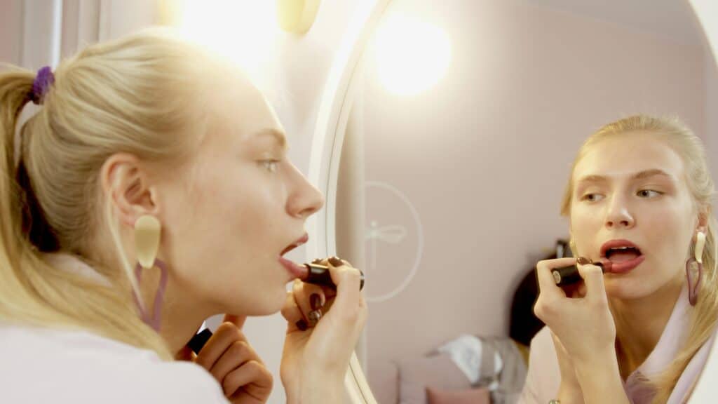 Woman putting on make up