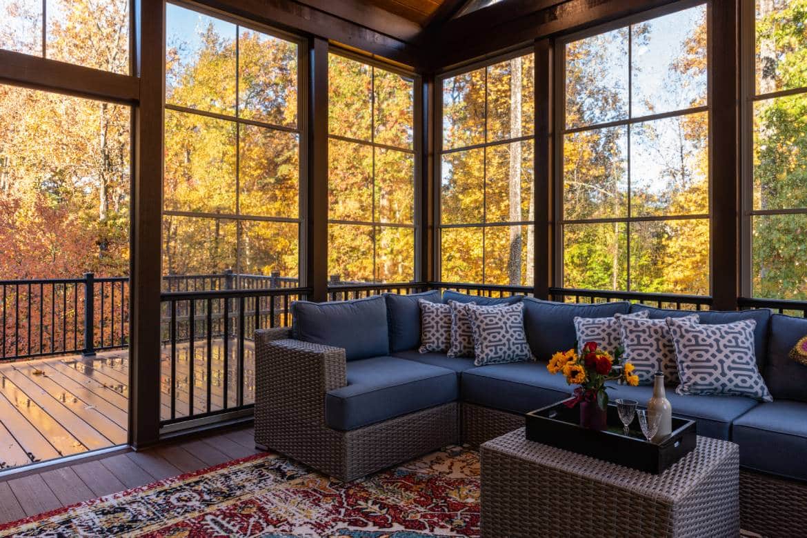 A cozy, comfy fall patio space where the leaves changed colors and the furniture is inviting and warm.