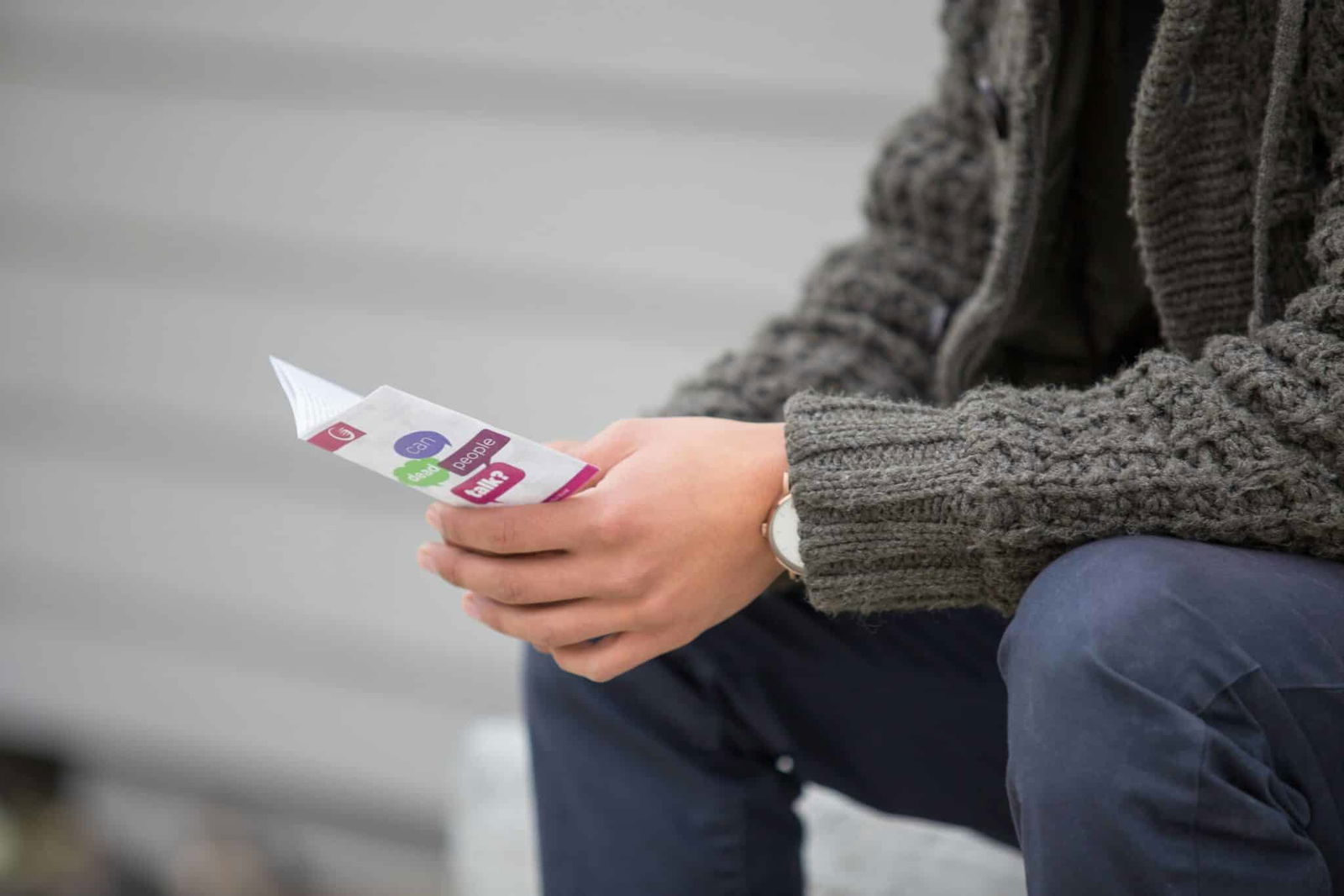 Man with pamphlet