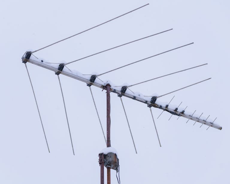 A snow-covered yagi antenna under a cloudy sky in canonsburg, pennsylvania.